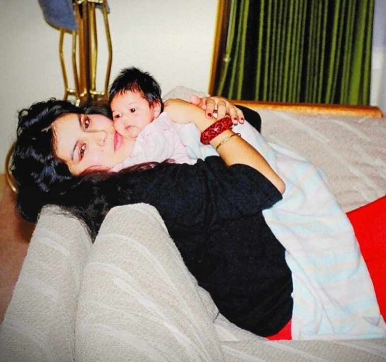 Angeline as a baby, held by her mom.